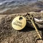gold key on rock, key is to believe