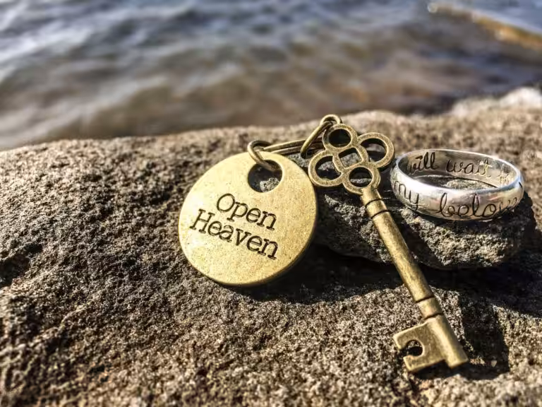 gold key on rock, key is to believe