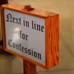 shallow focus photography of brown wooden floor signage